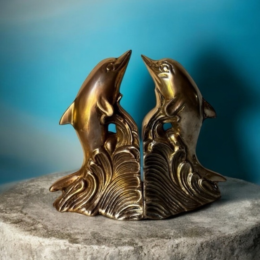 Vintage brass heavy dolphin bookends. Book ends